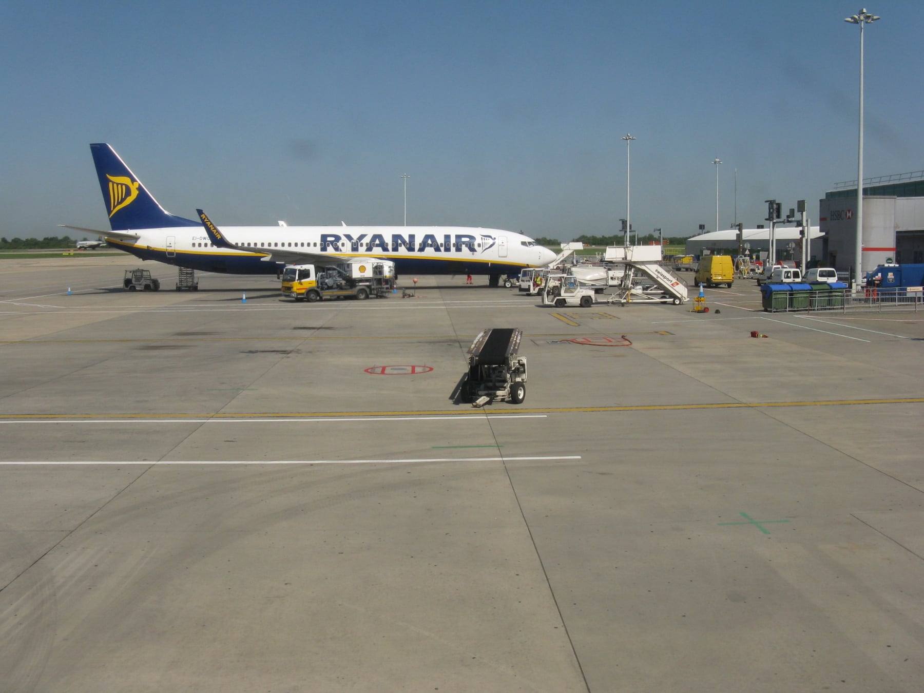 A Ryanair aircraft at a boarding stand at London Stansted Airport