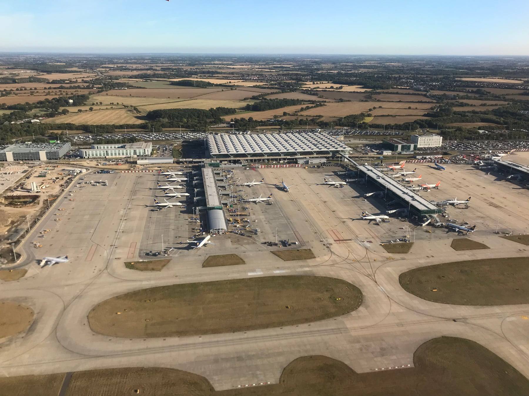 An aerial view of the terminal and aircraft stands at London Stansted Airport